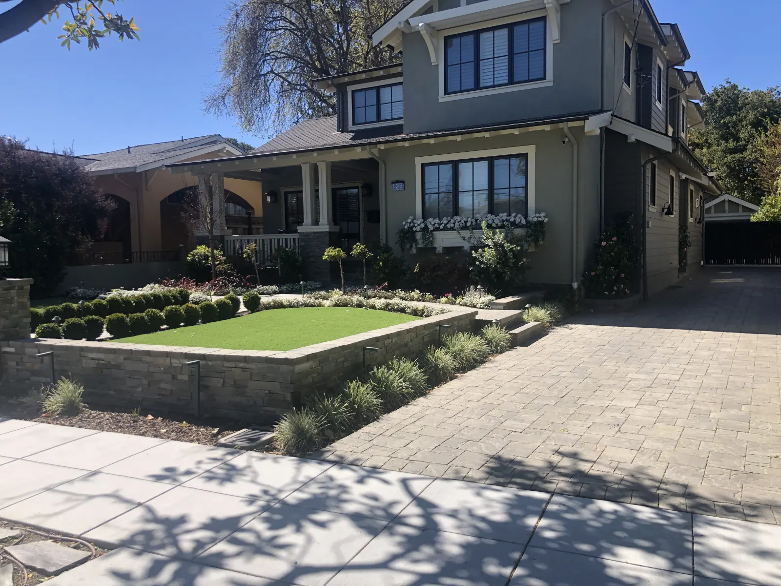 Sage-green Craftsman home exterior with new siding and trim in Burlingame
