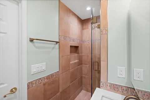 Traditional Bathroom Remodel with Custom Tile Detail — photo 10